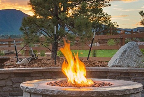 Warming Trends Outdoor Firepit with Landscaping